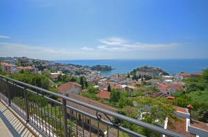 a view of a city and the ocean from a balcony at Apartments Cejovic in Ulcinj