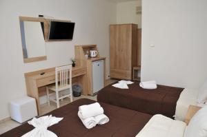 Ένα ή περισσότερα κρεβάτια σε δωμάτιο στο Denis Hotel and Bungalows 