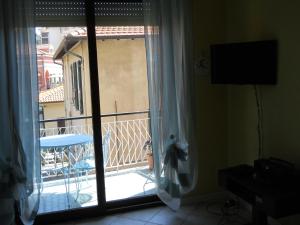 A television and/or entertainment centre at Appartamento Bordighera