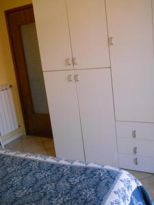 A bed or beds in a room at Appartamento Bordighera