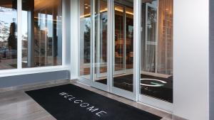 a welcome mat in front of a window at G Hotel Pescara in Pescara