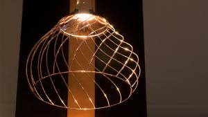 a glass wine bottle with a wire wrapped lamp at G Hotel Pescara in Pescara