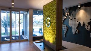 a lobby with a world map on the wall at G Hotel Pescara in Pescara