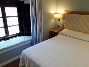 A bed or beds in a room at Hospedería Santa Elena
