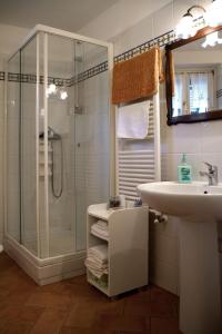 a bathroom with a shower and a sink at L'Antica Pieve Bed & Breakfast in Levanto