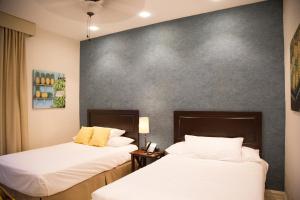 Katil atau katil-katil dalam bilik di Hotel Presidente Las Tablas