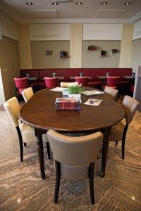 a conference room with a wooden table and chairs at Antwerp Harbour Hotel in Antwerp