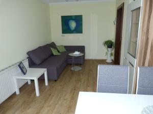 A seating area at Ferienhaus Blümel inkl. freier Strandbadeintritt