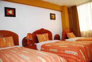 Postel nebo postele na pokoji v ubytování Hotel Don Sam