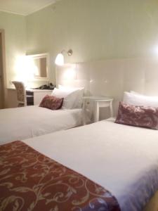 Ein Bett oder Betten in einem Zimmer der Unterkunft Avantazh Hotel