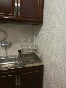 Η κουζίνα ή μικρή κουζίνα στο Red Tower Furnished Apartments