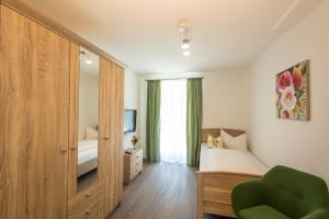 Ένα ή περισσότερα κρεβάτια σε δωμάτιο στο Ferienhaus Villa Alpenpanorama