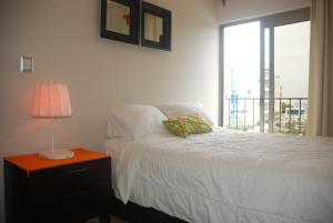 Postel nebo postele na pokoji v ubytování E&J Beach Condo