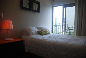 Postel nebo postele na pokoji v ubytování E&J Beach Condo