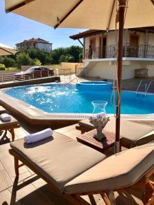 The swimming pool at or close to Driopes Villas