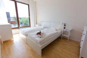 Postel nebo postele na pokoji v ubytování Komfortowy apartament Międzyzdroje