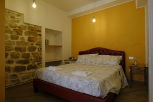 A bed or beds in a room at L'Orizzonte Relais Sirolo