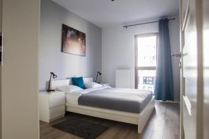 Posteľ alebo postele v izbe v ubytovaní Chill Apartments Jana Kazimierza