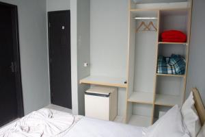 Postel nebo postele na pokoji v ubytování Hotel Dois Irmãos