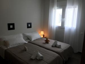 Ένα ή περισσότερα κρεβάτια σε δωμάτιο στο Apartamentos Fercamar Denia +12 φωτογραφίες
