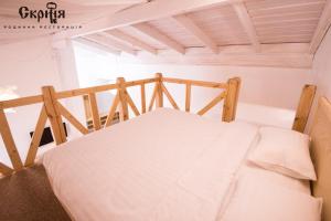 Postel nebo postele na pokoji v ubytování Hotel Skrinya