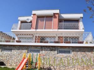 a building with a playground in front of it at Villa Liana in Bozhurets