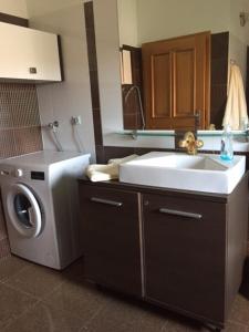 a kitchen with a washing machine and a sink at Apartments Lukas in Medulin +73 photos