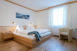 Кровать или кровати в номере Hotel & Landgasthof Ragginger Attersee