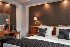 Voodi või voodid majutusasutuse Ava Hotel and Suites toas