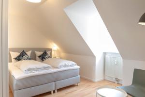 Ein Bett oder Betten in einem Zimmer der Unterkunft KulturQuartier