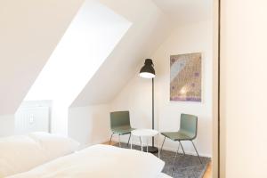 Ein Bett oder Betten in einem Zimmer der Unterkunft KulturQuartier