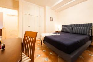 En eller flere senge i et værelse på Casa Vacanze Polifemo