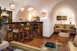 a living room filled with furniture and a kitchen at Hotel Villa Belvedere in Taormina