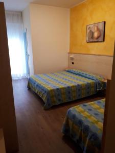 Postel nebo postele na pokoji v ubytování Hotel Mare