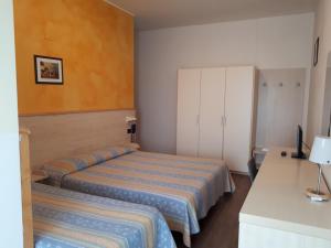 Postel nebo postele na pokoji v ubytování Hotel Mare