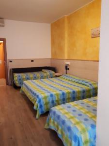 Postel nebo postele na pokoji v ubytování Hotel Mare