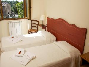 Postel nebo postele na pokoji v ubytování Residence Terme Di Sorano