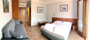 En eller flere senge i et værelse på Locanda Speranza