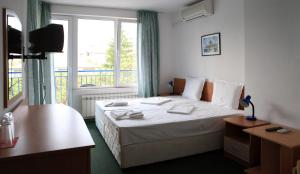 Postel nebo postele na pokoji v ubytování R&G Hotel