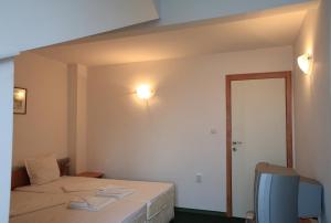 Postel nebo postele na pokoji v ubytování R&G Hotel