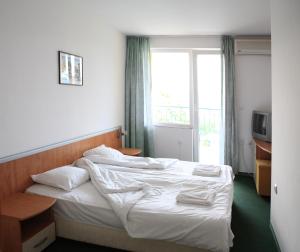 Postel nebo postele na pokoji v ubytování R&G Hotel