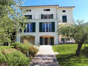 a villa with a garden in front of it at Albergo Blueline in Tellaro