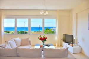 A television and/or entertainment centre at Luxury Suites in Stavromenos