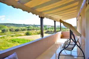 A balcony or terrace at Luxury Suites in Stavromenos