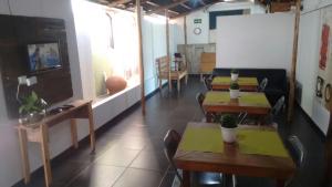 a restaurant with tables and chairs in a room at Hotel Aldeia Cerrado in Goiânia