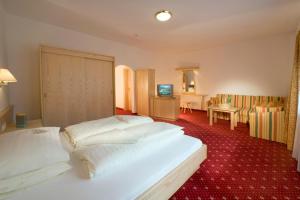 Ein Bett oder Betten in einem Zimmer der Unterkunft Superior Hotel Persal