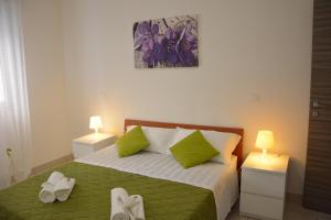 A bed or beds in a room at Green Residence