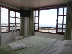 Tempat tidur dalam kamar di Ver a Vista Hotel