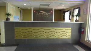 a hair salon with a yellow and gray wall at Baymont by Wyndham Walterboro in Walterboro