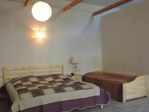 A bed or beds in a room at Sno House Kazbegi